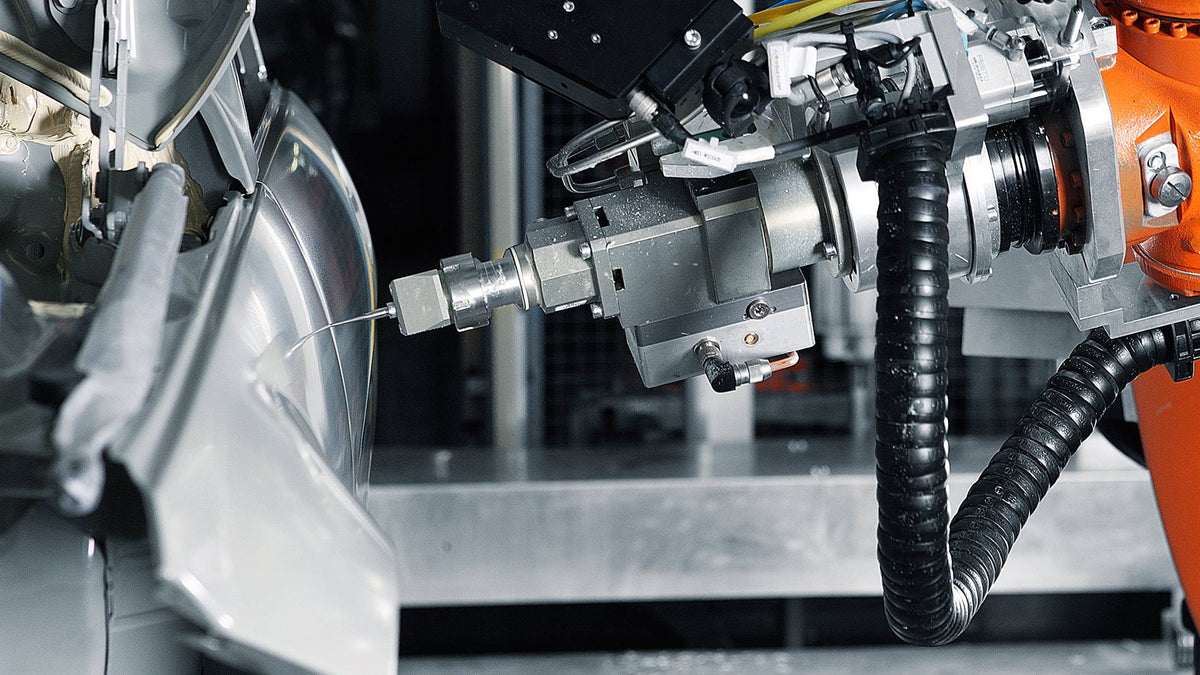 Robot de unión adhesiva